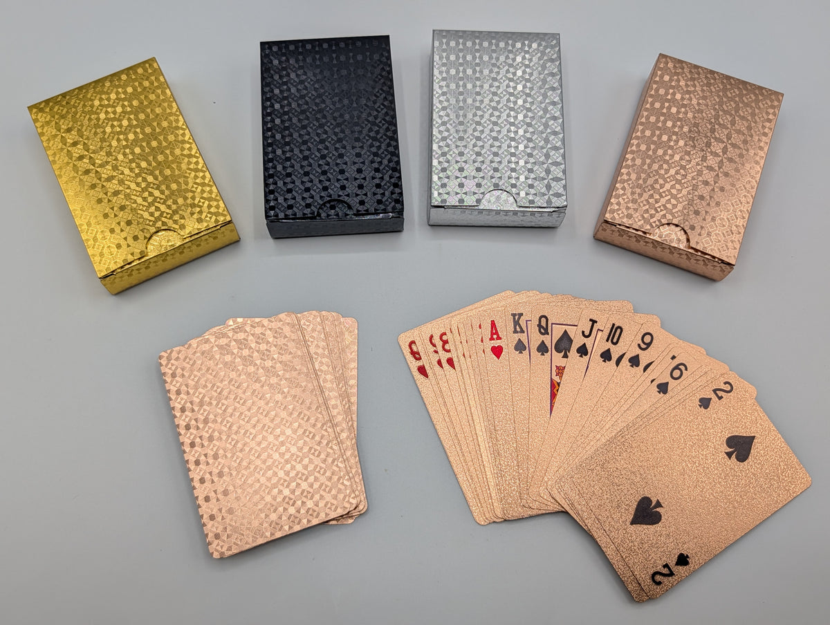Rose gold waterproof PET plastic playing cards with embossed foil, showing card faces and patterned backs