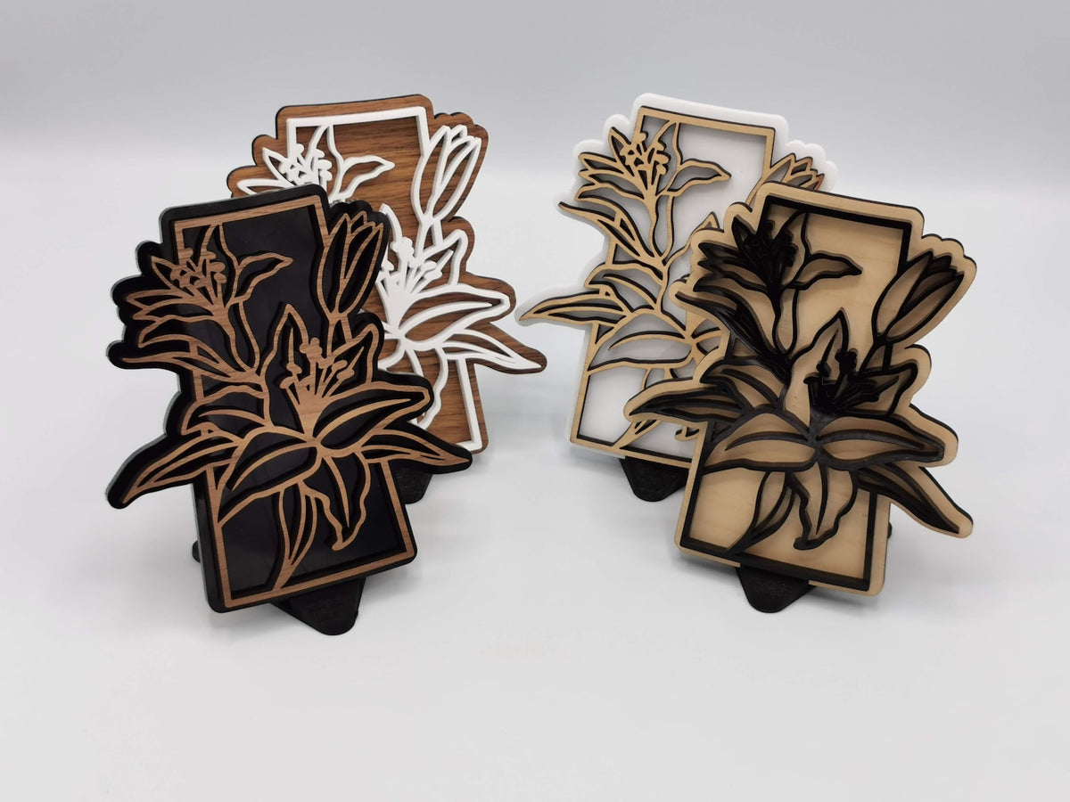 Saskatchewan lily signs in contrasting wood and acrylic finishes
