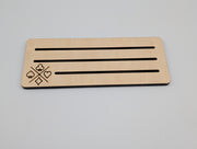 Single maple playing card holder showing rounded corners, three slots and engraved suit motif