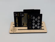 Close-up of a maple playing card holder with cards standing in the slots; cards sold separately