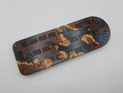 Midnight Islands Origin brasiletta cribbage board with smoky midnight blue resin — playing face.