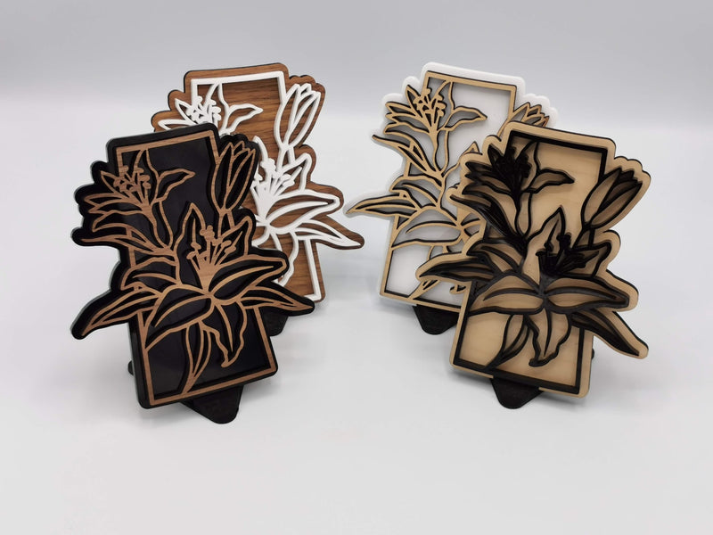 Saskatchewan lily signs in contrasting wood and acrylic finishes