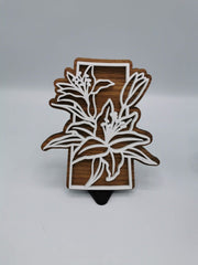 Saskatchewan lily sign in white over walnut