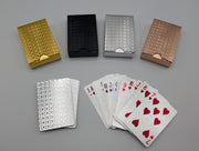 Silver waterproof PET plastic playing cards with embossed foil, showing card faces and patterned backs