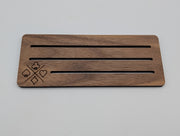 Single walnut playing card holder showing rounded corners, three slots and engraved suit motif