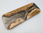 One-of-a-kind Imprint brown mallee burl cribbage board with real Saskatchewan-grown wheat, front showing the cribbage tracks and natural burl edges.