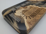 One-of-a-kind Imprint brown mallee burl cribbage board with real Saskatchewan-grown wheat, close-up of the inlay, burl grain and playing holes.