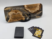 One-of-a-kind Imprint brown mallee burl cribbage board with real Saskatchewan-grown wheat, on its included display stand with pegs and a black playing-card deck.