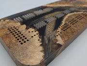 One-of-a-kind Imprint brown mallee burl cribbage board with real Saskatchewan-grown wheat, close-up of the inlay, burl grain and playing holes.